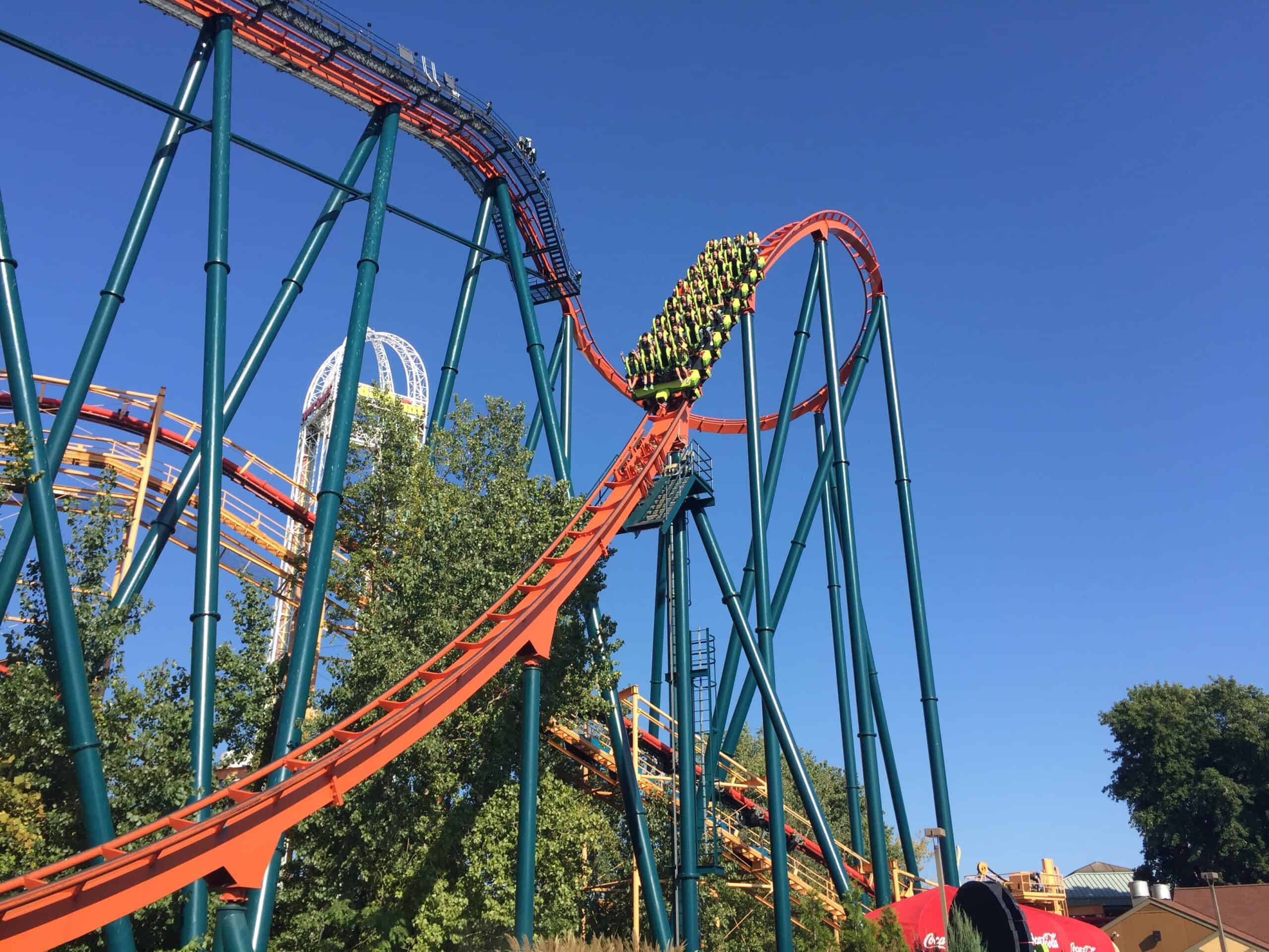 view of roller coaster train coming down first drop.