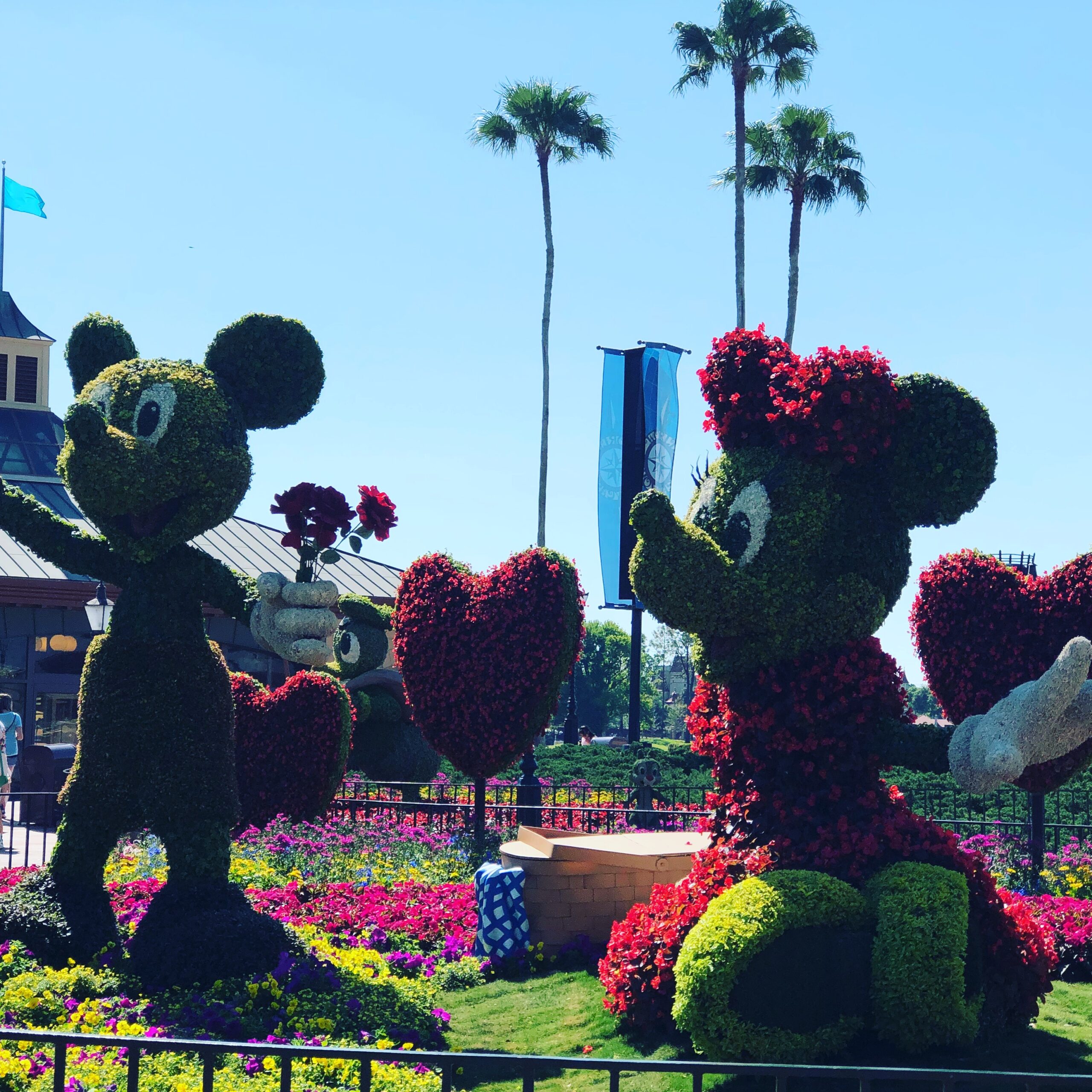 Mickey and Minnie Mouse made out of flowers and bushes